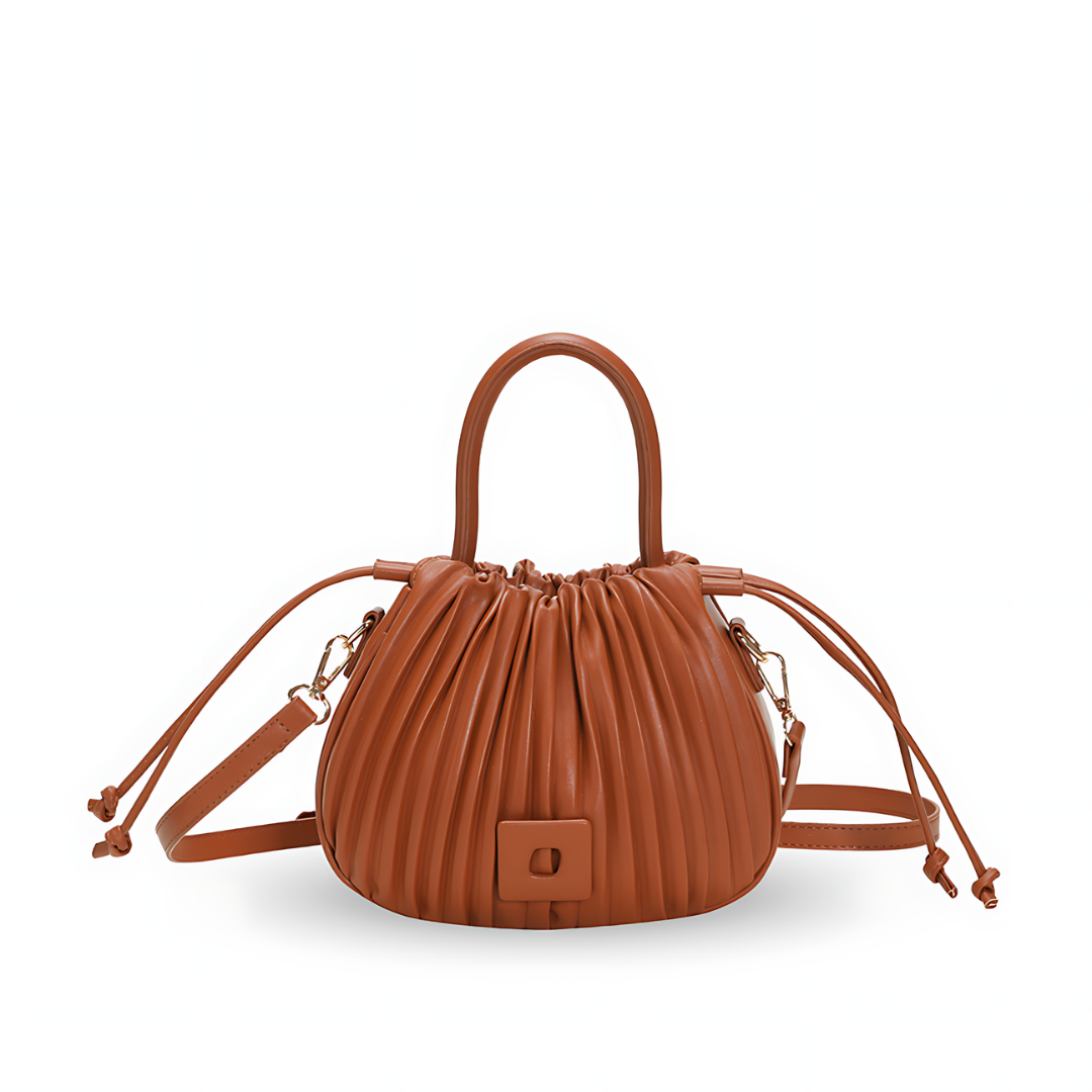 Luxuriöse Vintage Umhängetasche aus hochwertigem PU-Leder in Farbe Camel, abgebildet auf neutralem Hintergrund. Die Tasche kombiniert klassisches Design mit modernem Luxus und bietet ein geräumiges Hauptfach sowie einen verstellbaren Schulterriemen für vielseitigen Tragekomfort.